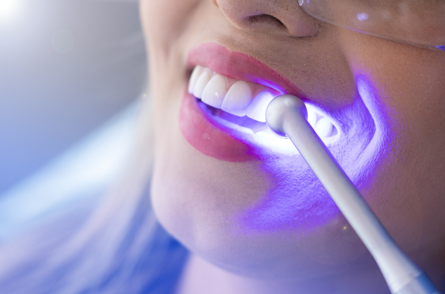 woman having her teeth checked by the dentist in an office